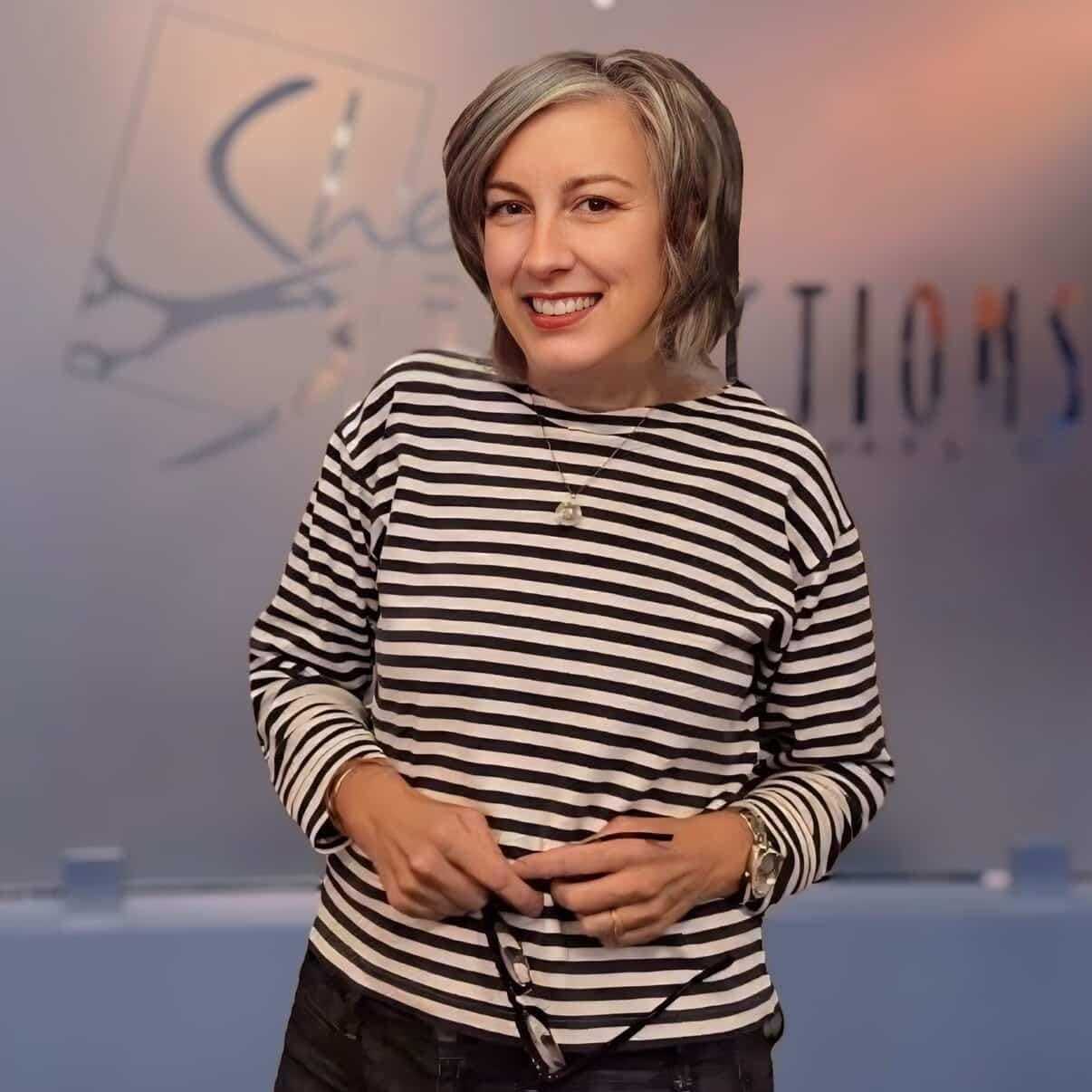Portrait of Sharon, a professional stylist at Shear Reflections Hair Salon, showcasing their expertise and style.