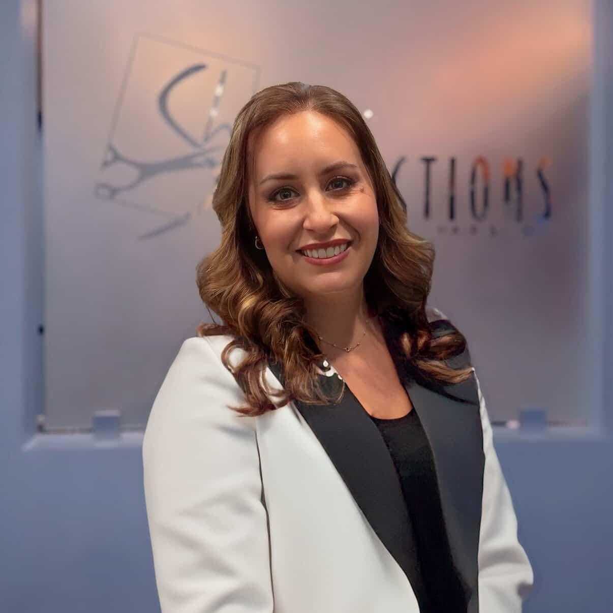 Portrait of Ilyssa, a professional stylist at Shear Reflections Hair Salon, showcasing their expertise and style.