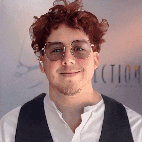 Portrait of Rowan, a professional stylist at Shear Reflections Hair Salon, showcasing their expertise and style.