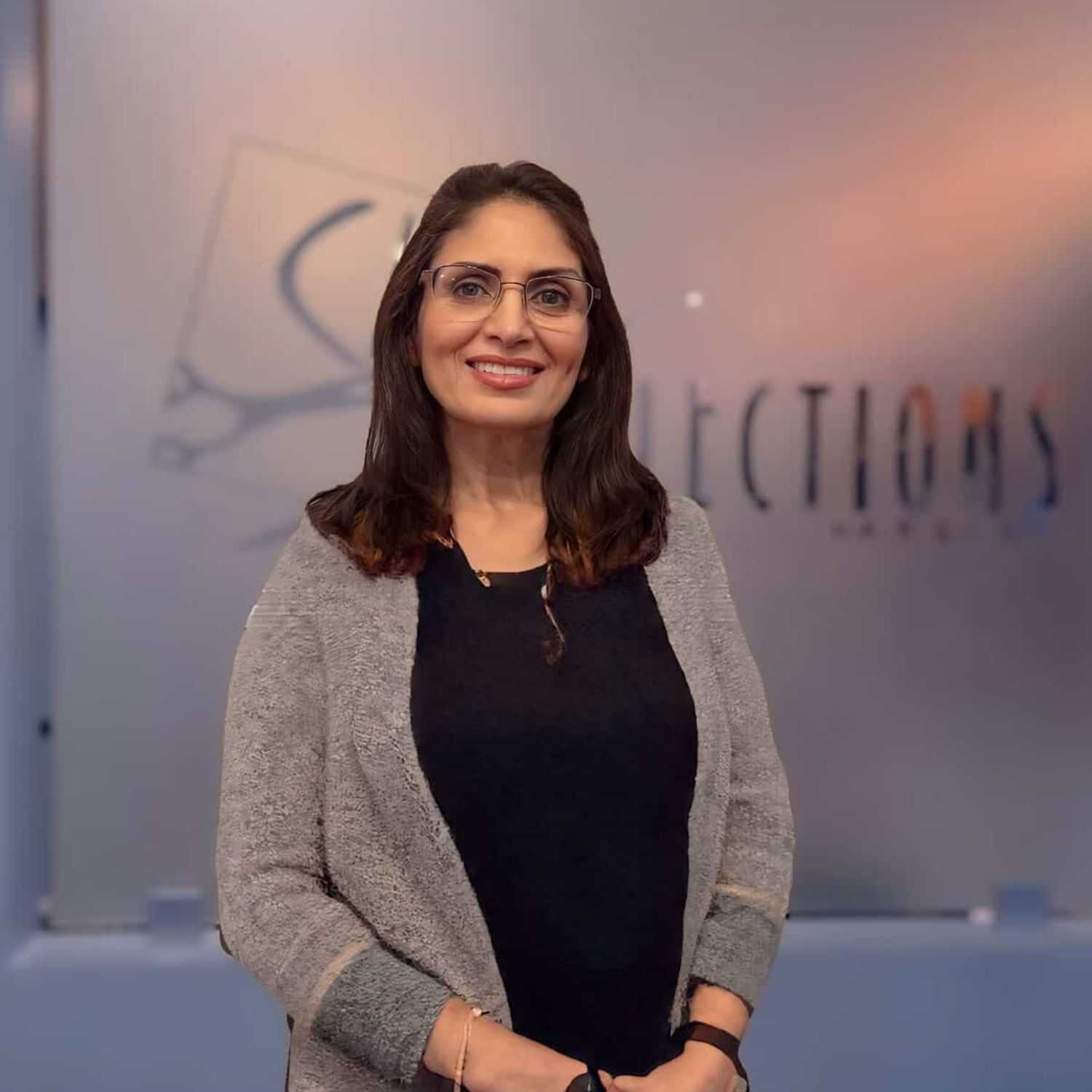 Portrait of Pinky, a professional stylist at Shear Reflections Hair Salon, showcasing their expertise and style.